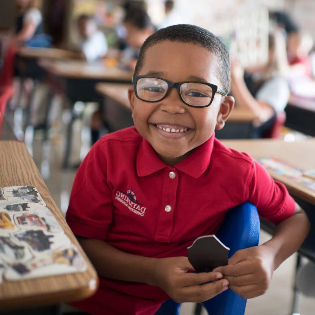 A smiling kindergarten student at Dayspring Christian Academy in Lancaster, PA